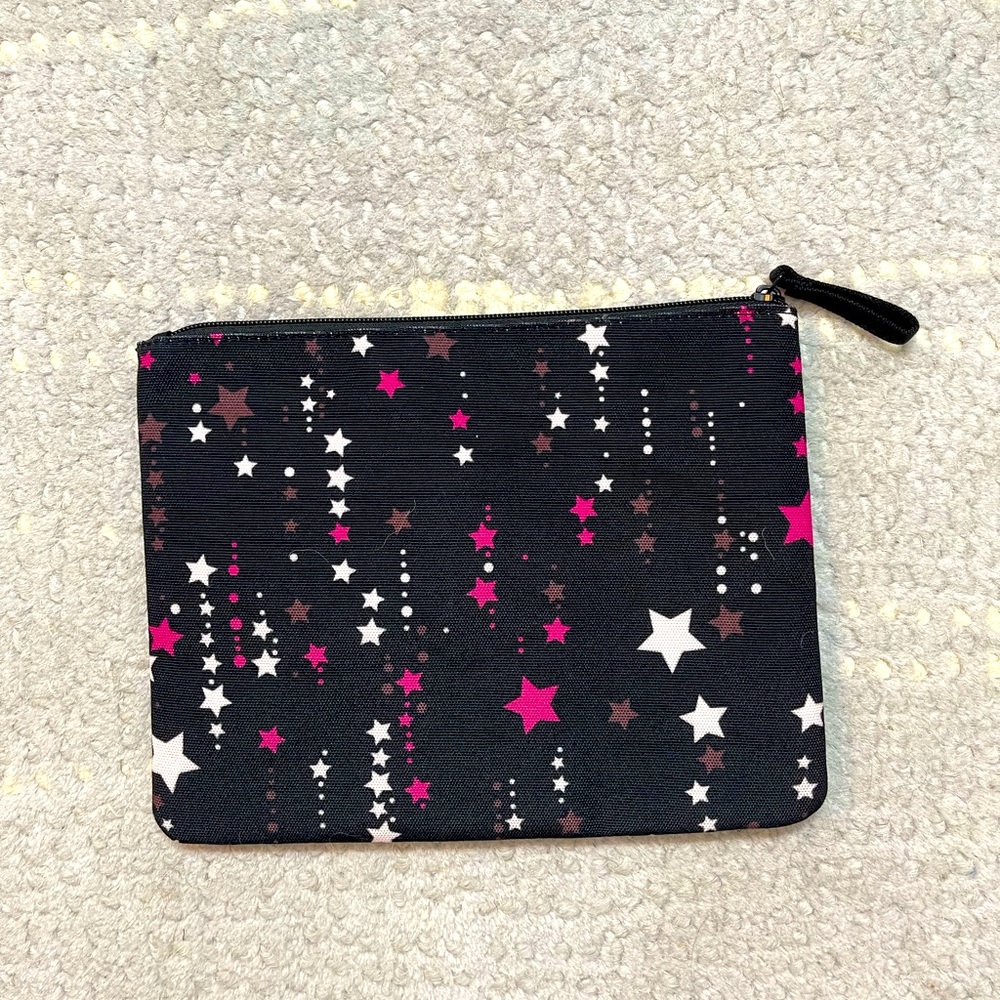 Kate Spade New York starlight themed cosmetic case/clutch.